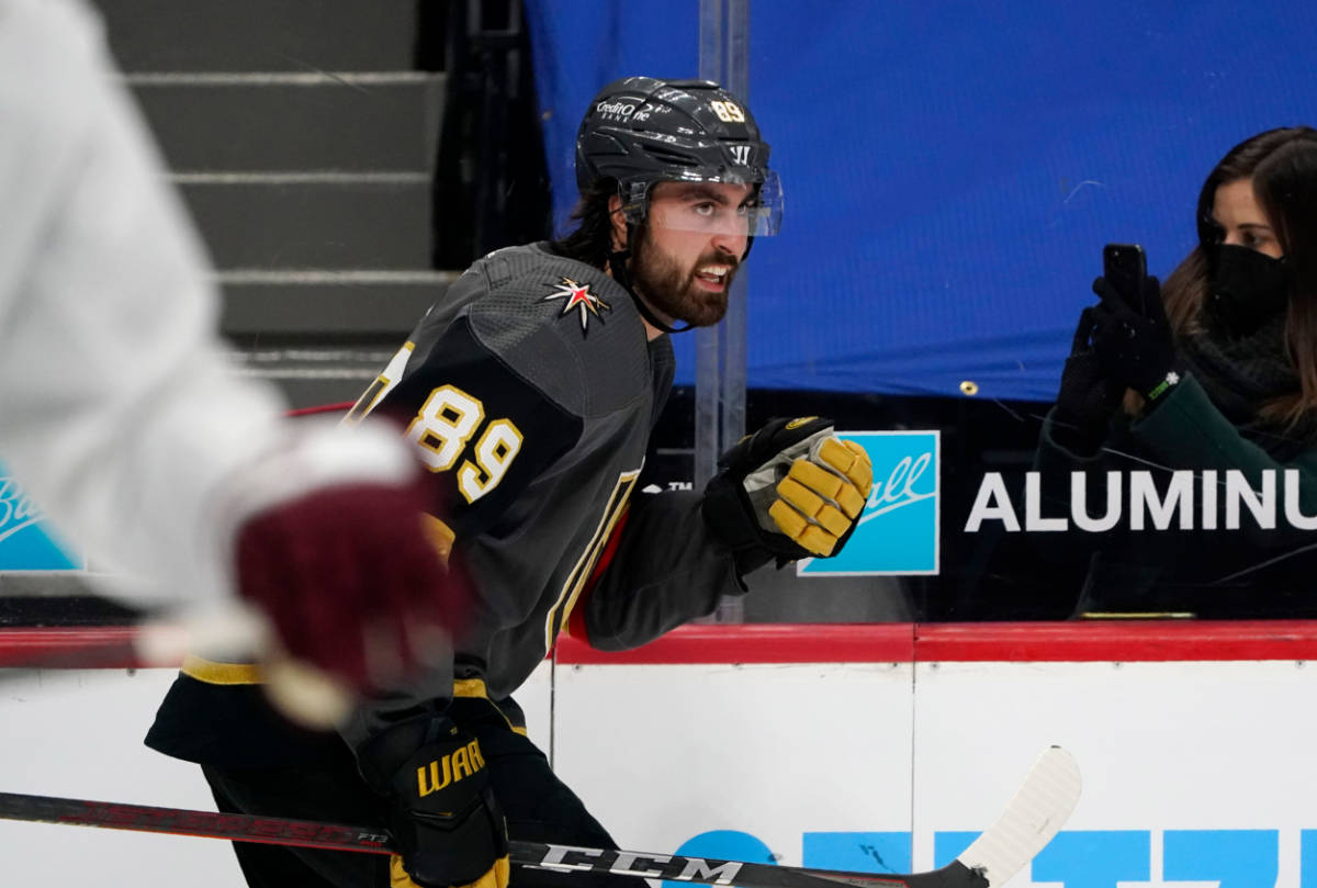 Vegas Golden Knights right wing Alex Tuch, back, reacts after scoring a goal against the Colora ...