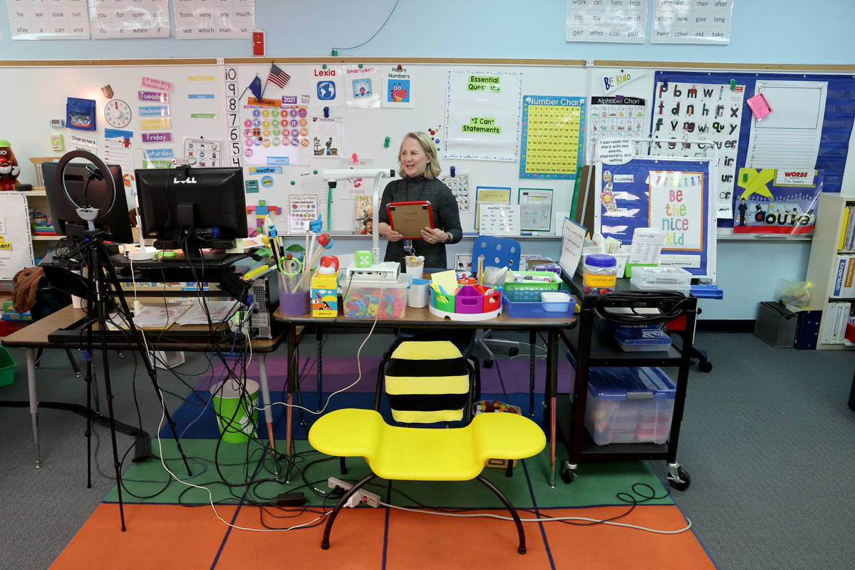Kindergarten teacher Suzy Huffer prepares her classroom at McDoniel Elementary School in Hender ...