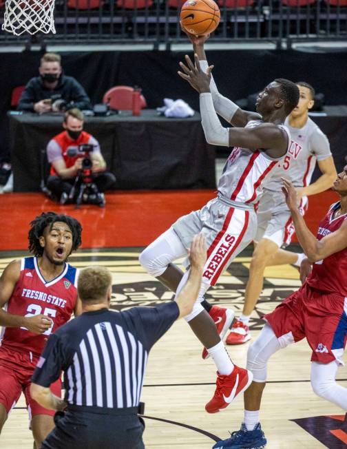 UNLV Rebels forward Cheikh Mbacke Diong (34) elevates to shoot as Fresno State Bulldogs guard A ...