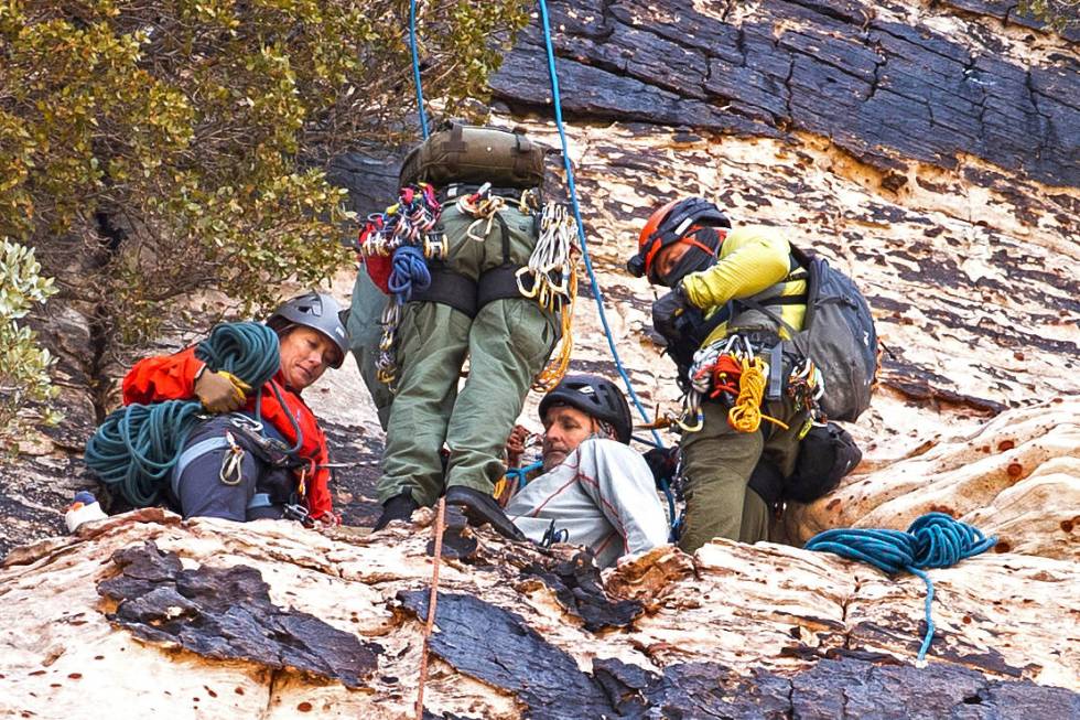 Metropolitan Police Department search and rescue lowers a climber to an extraction point after ...