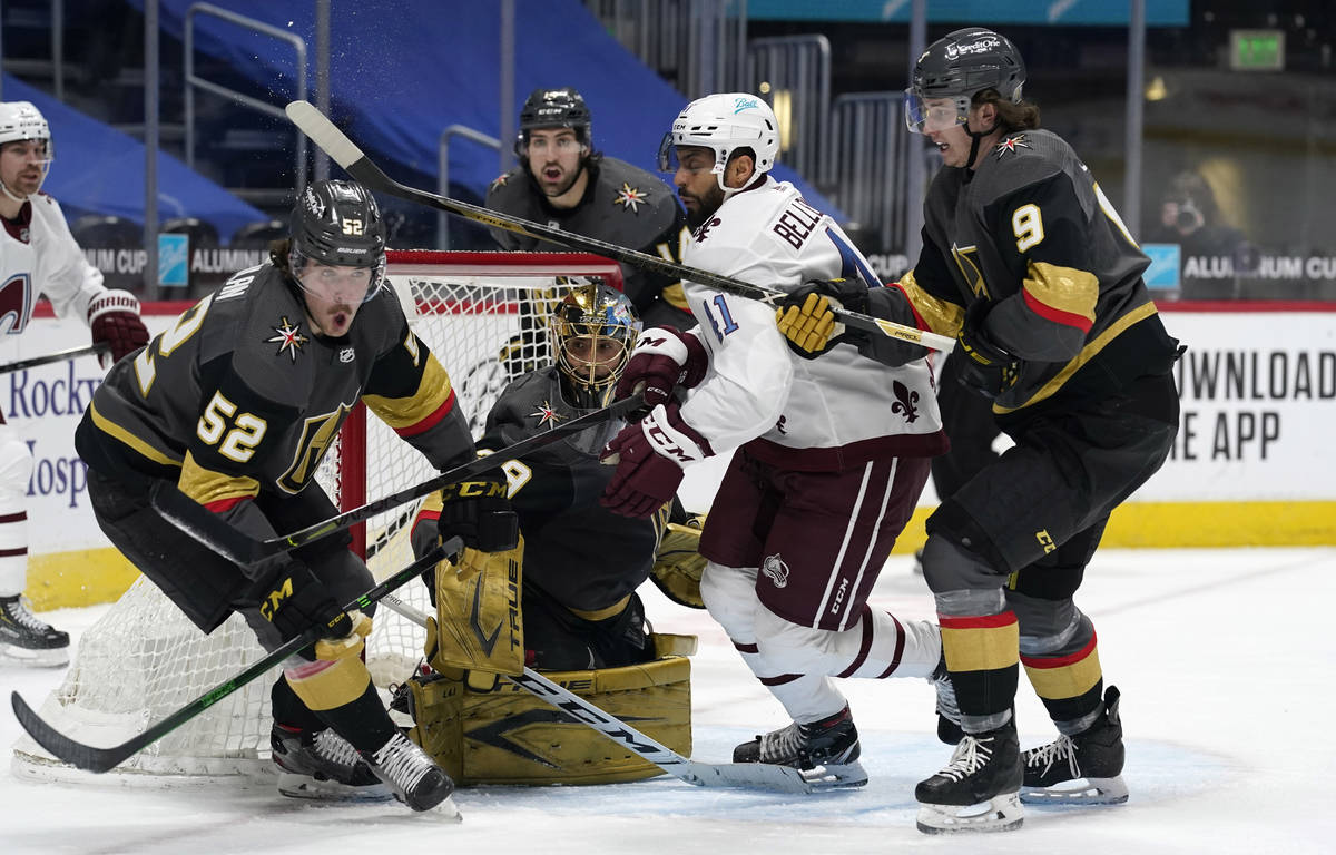 Colorado Avalanche center Pierre-Edouard Bellemare, third from left, battles for control of a l ...