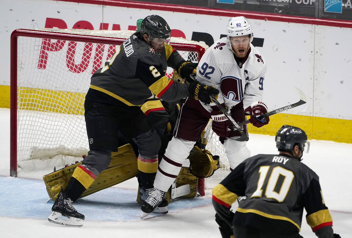 Colorado Avalanche left wing Gabriel Landeskog, back, right, fights for position in front of th ...