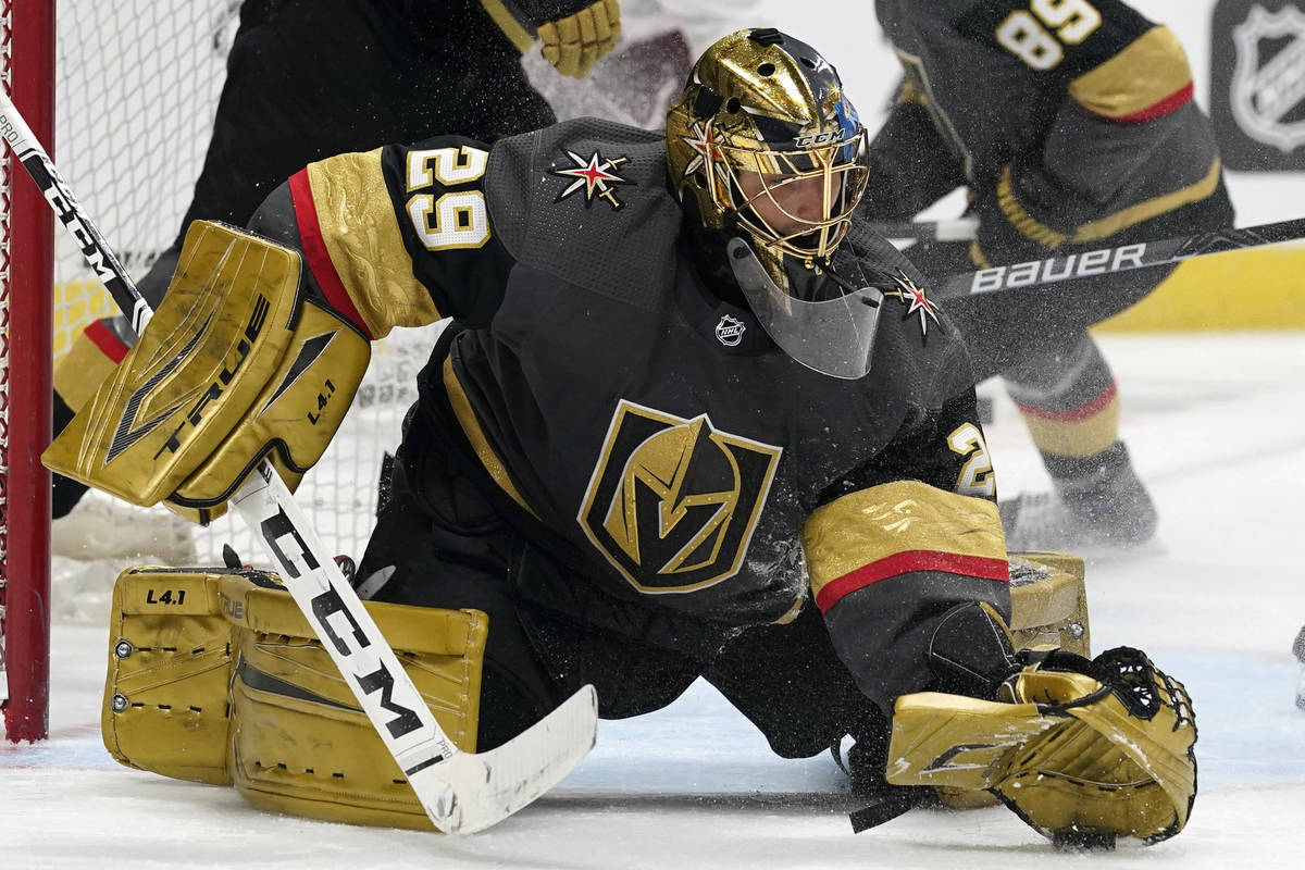 Vegas Golden Knights goaltender Marc-Andre Fleury makes a glove save of a shot against the Colo ...