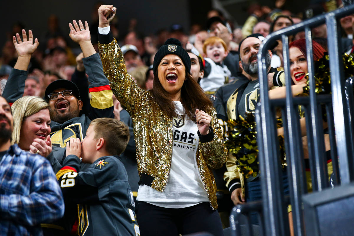 Golden Knights fans celebrate a goal by Tomas Nosek, not pictured, during the first period of a ...