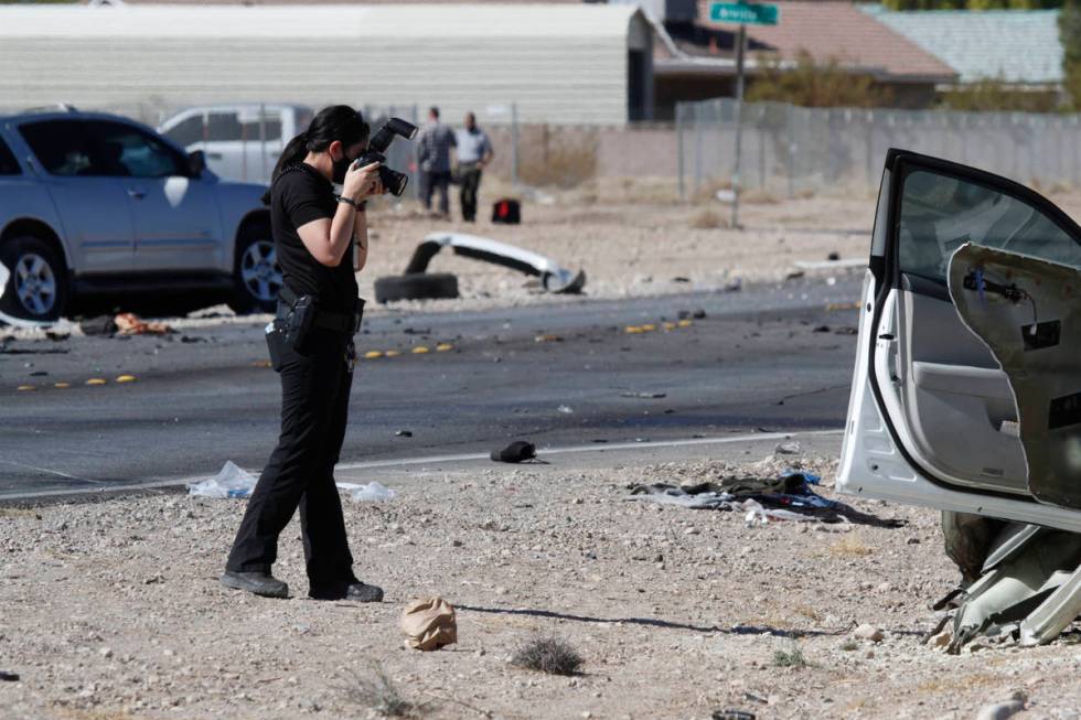 Las Vegas police investigate a crash at the intersection of Warm Springs Road and South Schirll ...