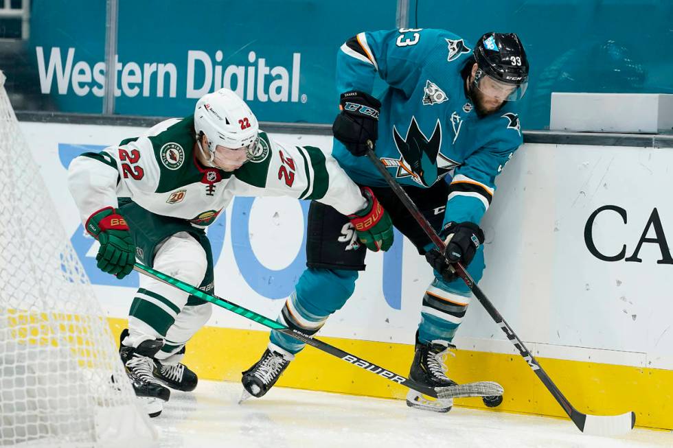 Minnesota Wild left wing Kevin Fiala (22) battles for the puck against San Jose Sharks defensem ...