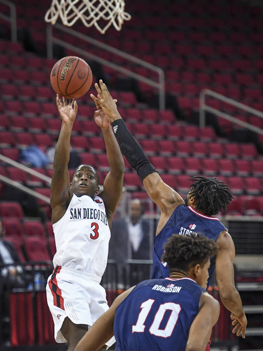 San Diego State's Terrell Gomez puts up a 3-point attempt against Fresno State during an NCAA c ...