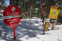 A sign alerts skiers to danger on Corona Bowl, known for its extreme skiing, at Eldora Mountain ...