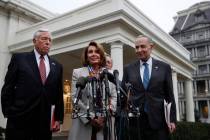 House Democratic leader Nancy Pelosi of California, center, speaks to the media after meeting w ...