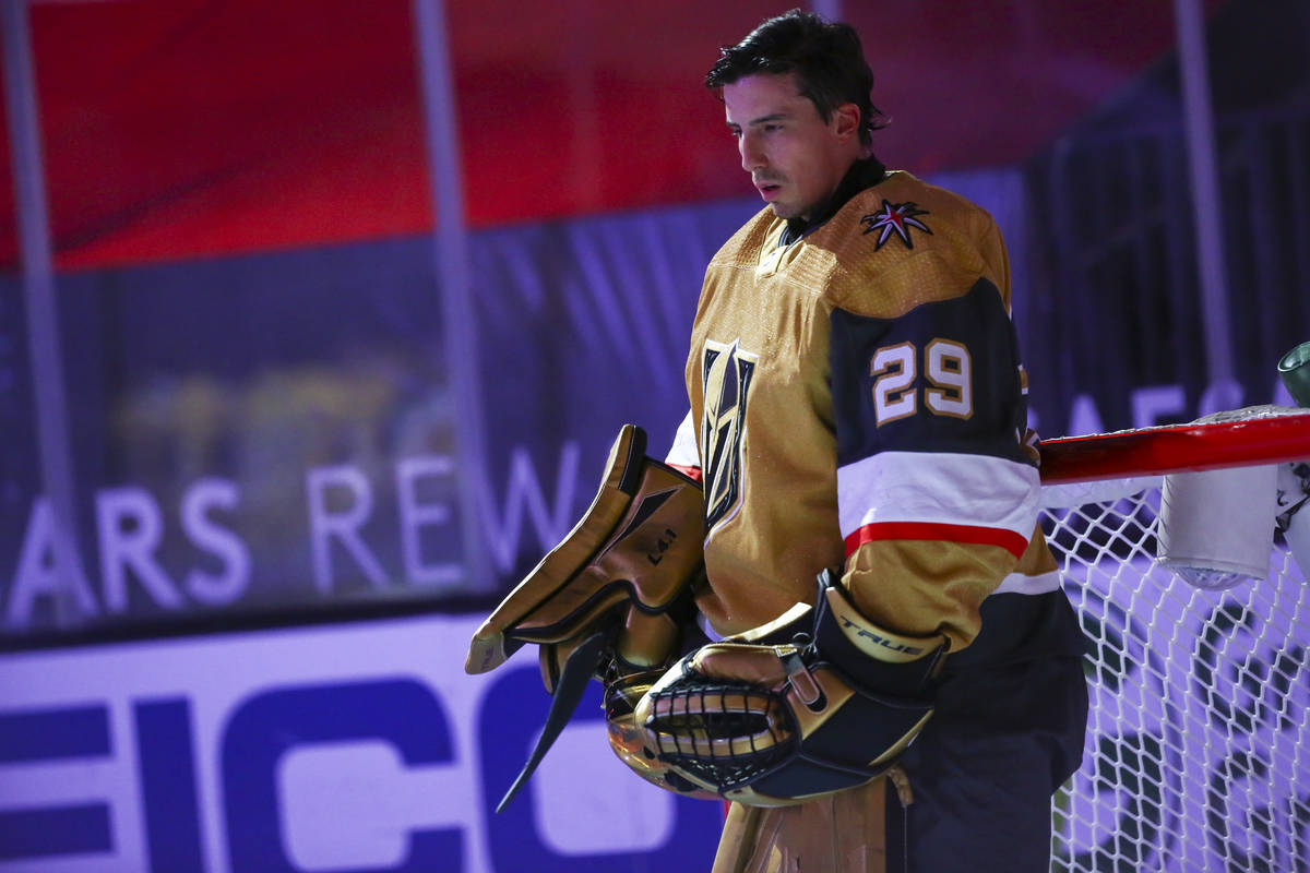 Golden Knights goaltender Marc-Andre Fleury (29) stands for the national anthem before an NHL h ...