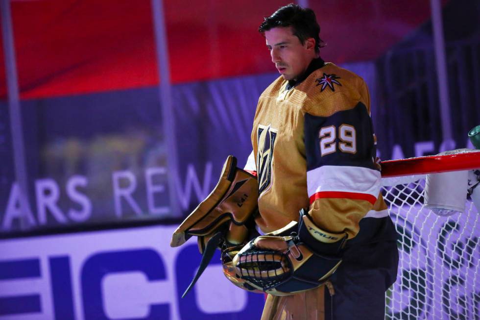 Golden Knights goaltender Marc-Andre Fleury (29) stands for the national anthem before an NHL h ...
