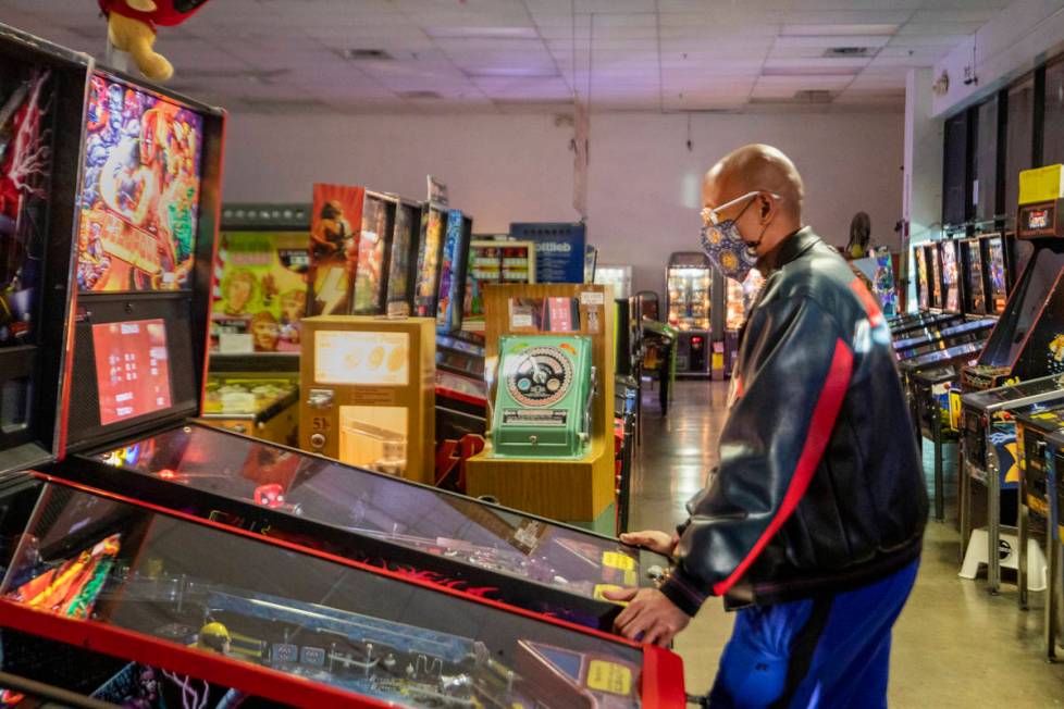 Oliver Blair, 46, of San Antonio, Texas, plays games at the Pinball Hall of Fame in 2020 in Las ...