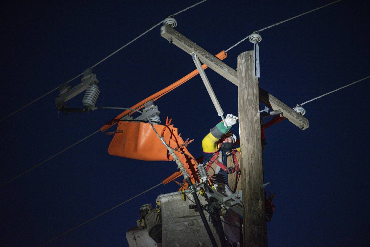 Oncor apprentice lineman Brendan Waldon repairs a utility pole that was damaged by the winter s ...