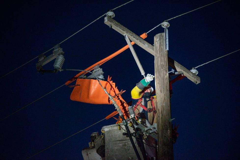 Oncor apprentice lineman Brendan Waldon repairs a utility pole that was damaged by the winter s ...