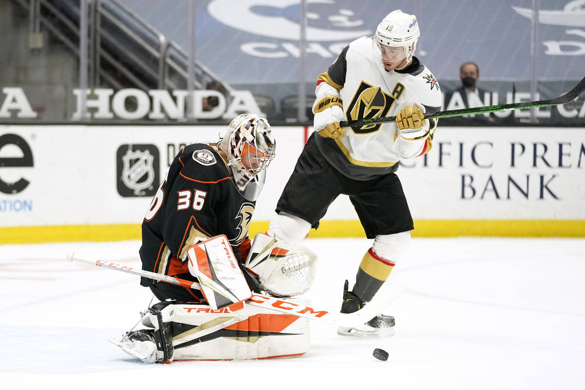 Anaheim Ducks goaltender John Gibson, left, deflects a shot as Vegas Golden Knights right wing ...