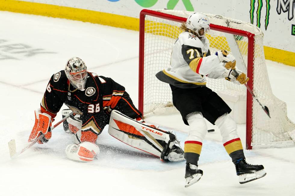 Vegas Golden Knights center William Karlsson, right, scores the game-winner past Anaheim Ducks ...