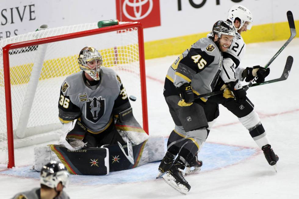 Henderson Silver Knights goaltender Logan Thompson (36) misses a shot for a goal as defenseman ...