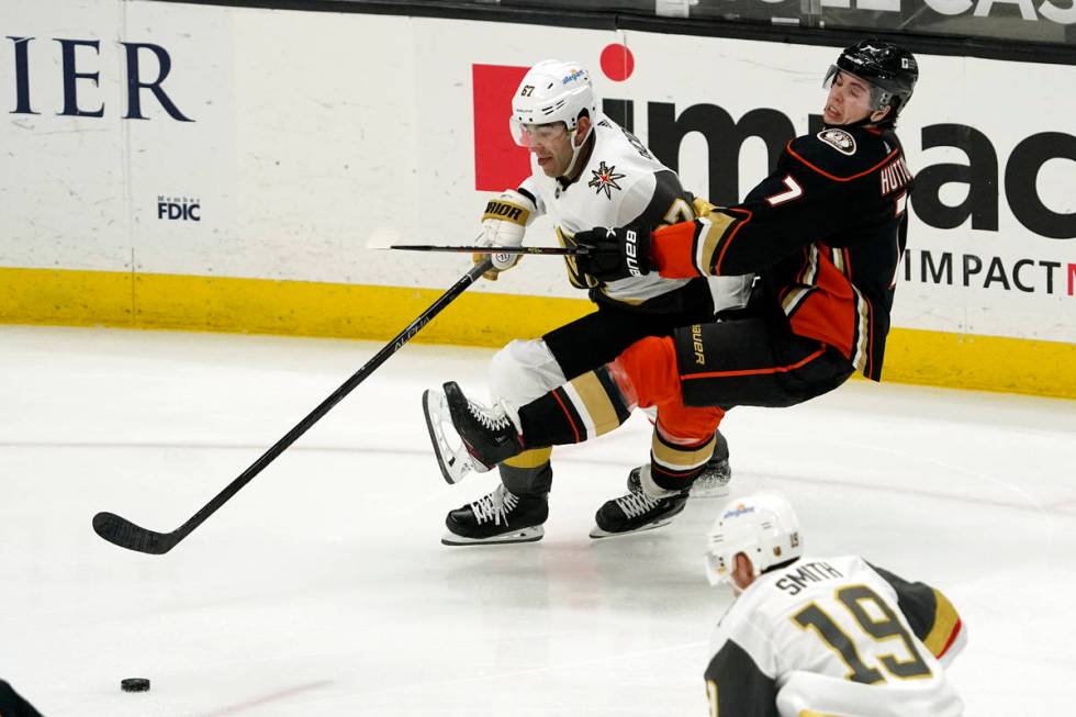 Vegas Golden Knights left wing Max Pacioretty, left, and Anaheim Ducks defenseman Ben Hutton ba ...