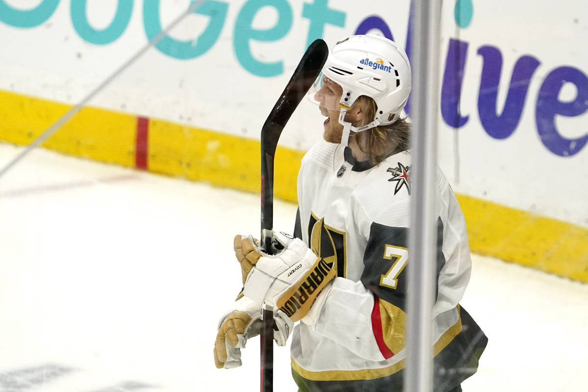 Vegas Golden Knights center William Karlsson, right, celebrates his game-winning goal during ov ...