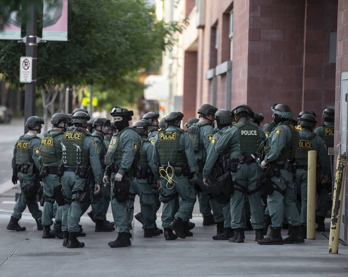 Police officers mobilize in downtown Las Vegas on June 3, 2020, after the killing of George Flo ...
