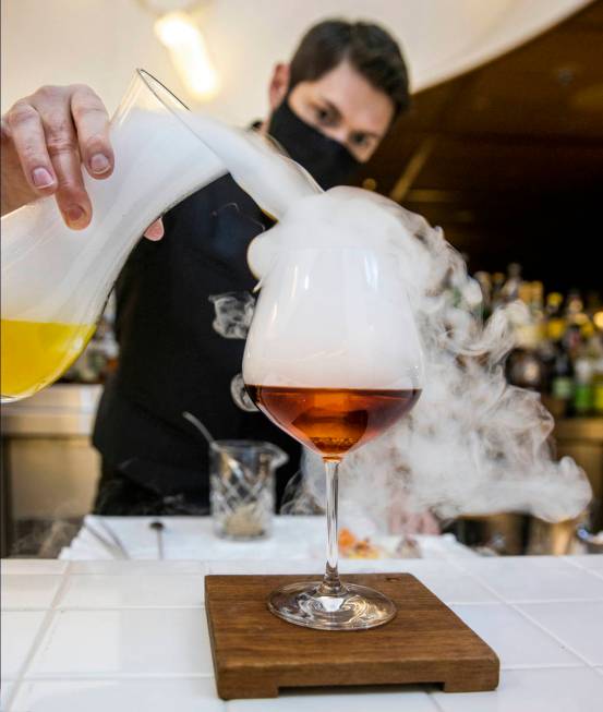 Bartender Casey Freeman creates a Foggy Hill Negroni made with Vida mezcal, Cynar, Aperol, fog ...
