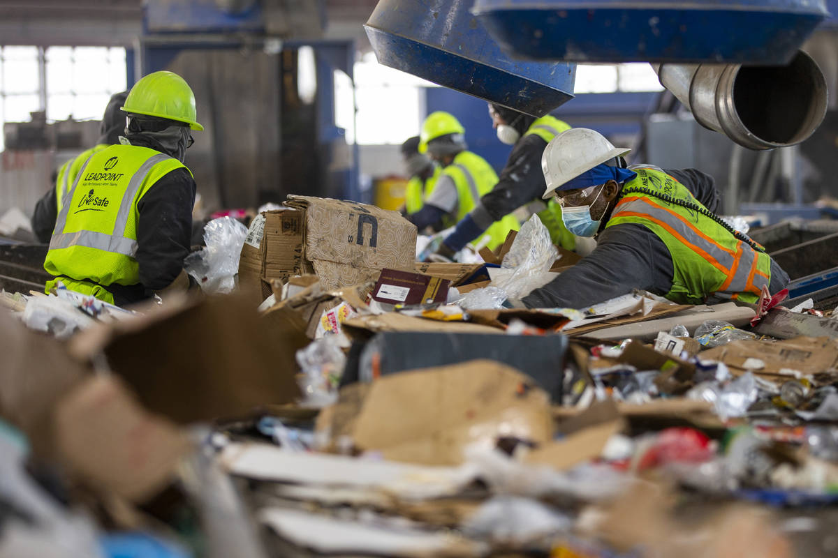 Workers on the pre-sort deck pull out nonrecyclable material and larger items at the Republic S ...