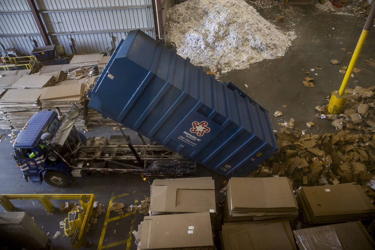 Separated cardboard is dumped to be baled at the Republic Services recycling center on Jan. 15, ...