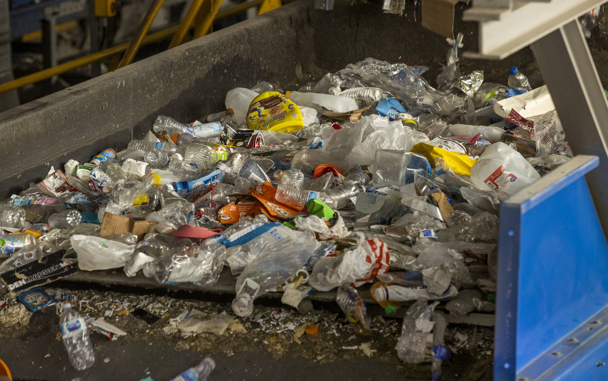 Recyclable material moves along a conveyor belt to be sorted at the Republic Services recycling ...