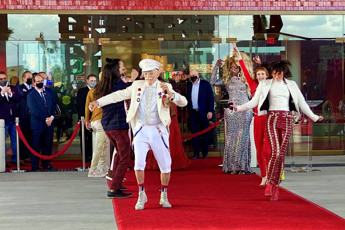 Doc Phineas Kastle, center, and dancers move up the red carpet and into the venue during the Vi ...