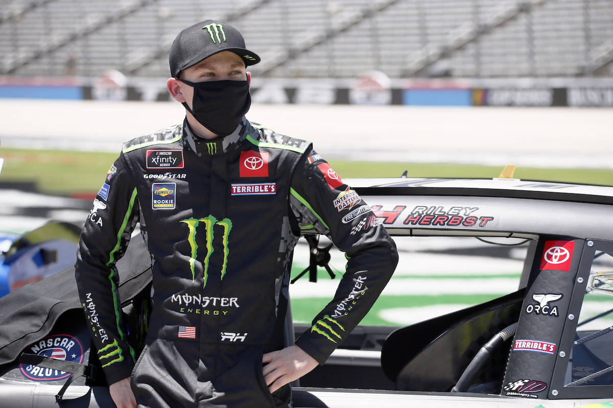 Riley Herbst stands next to his car prior to the NASCAR Xfinity auto race at Texas Motor Speedw ...