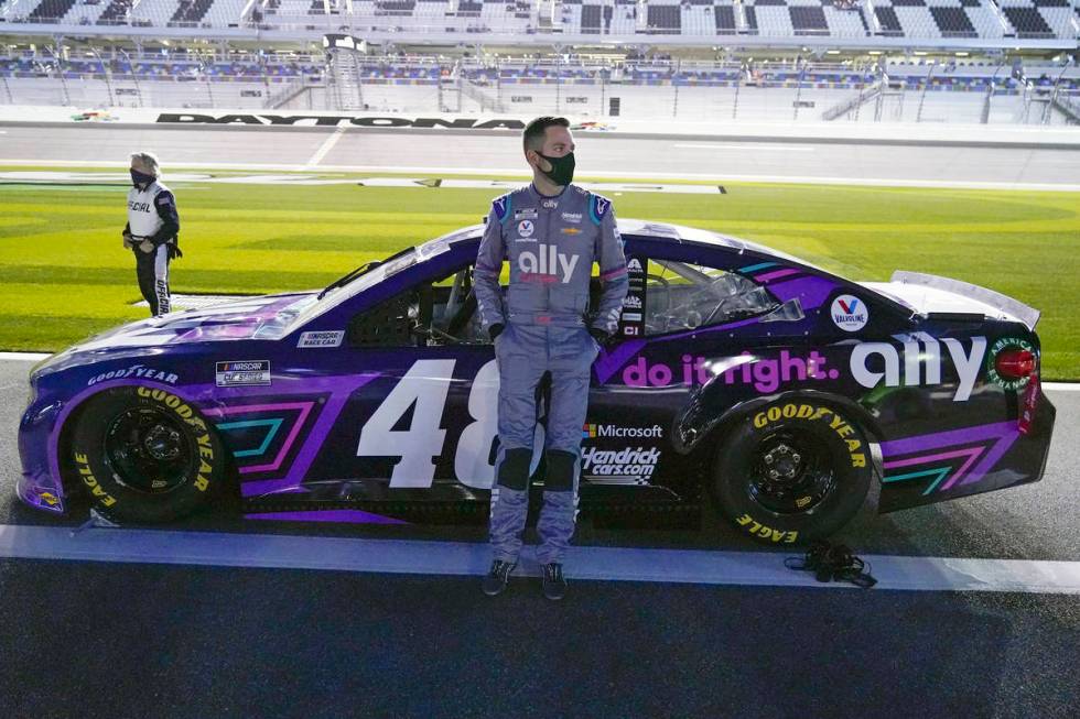 Alex Bowman stands by his car before the start of the NASCAR Clash auto race at Daytona Interna ...
