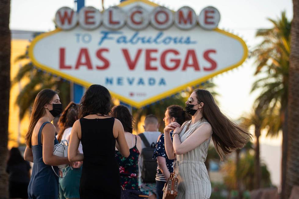 People wait in line to take photos at the Welcome to Fabulous Las Vegas Sign on Thursday, July ...