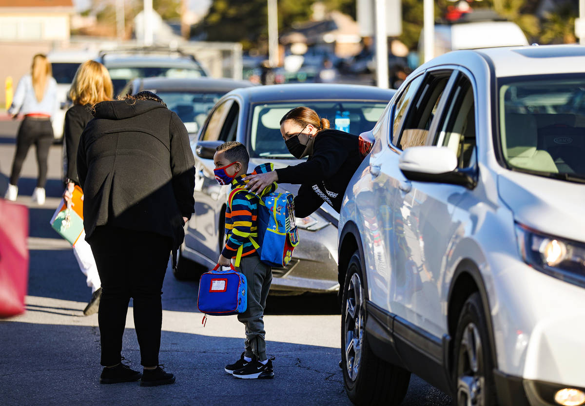 Students are dropped off at Cyril Wengert Elementary School in Las Vegas, Monday, March 1, 2021 ...