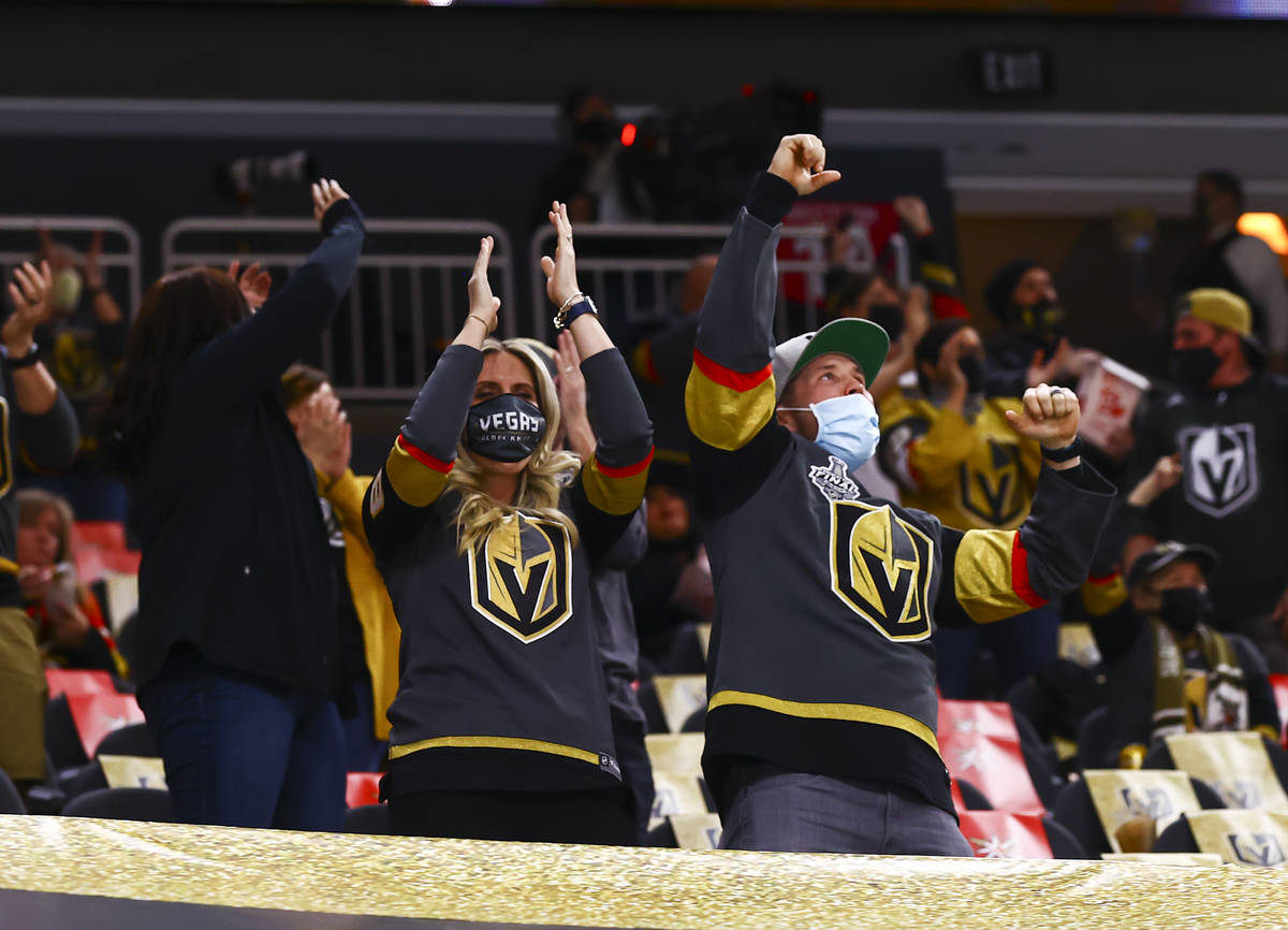 Fans celebrate a goal by Golden Knights center Cody Glass, not pictured, during the second peri ...