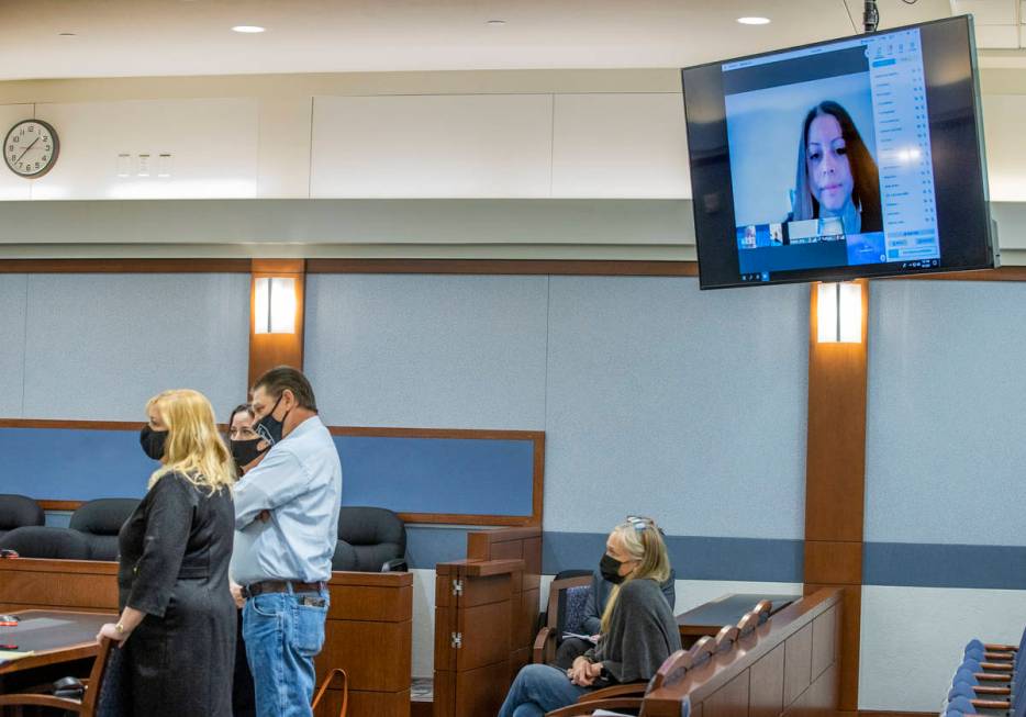 (From left) Attorney Lisa Rasmussen, attorney Kristina Wildeveld, Fred Steese and others listen ...