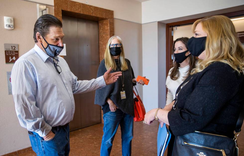 (From left) Fred Steese talks with Nancy Lemcke, attorneys Kristina Wildeveld and Lisa Rasmusse ...