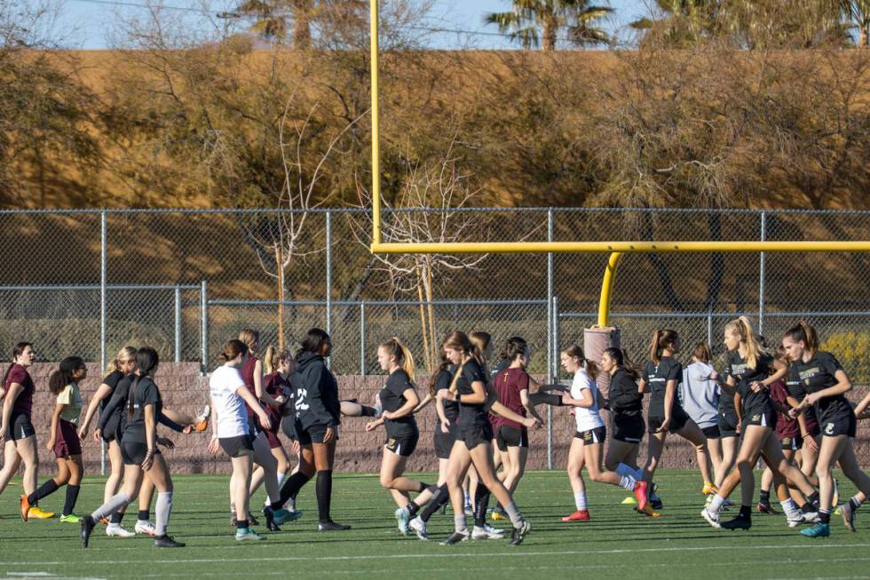 Players warm up during girlÕs soccer team practice at Faith Lutheran High School on Monday ...