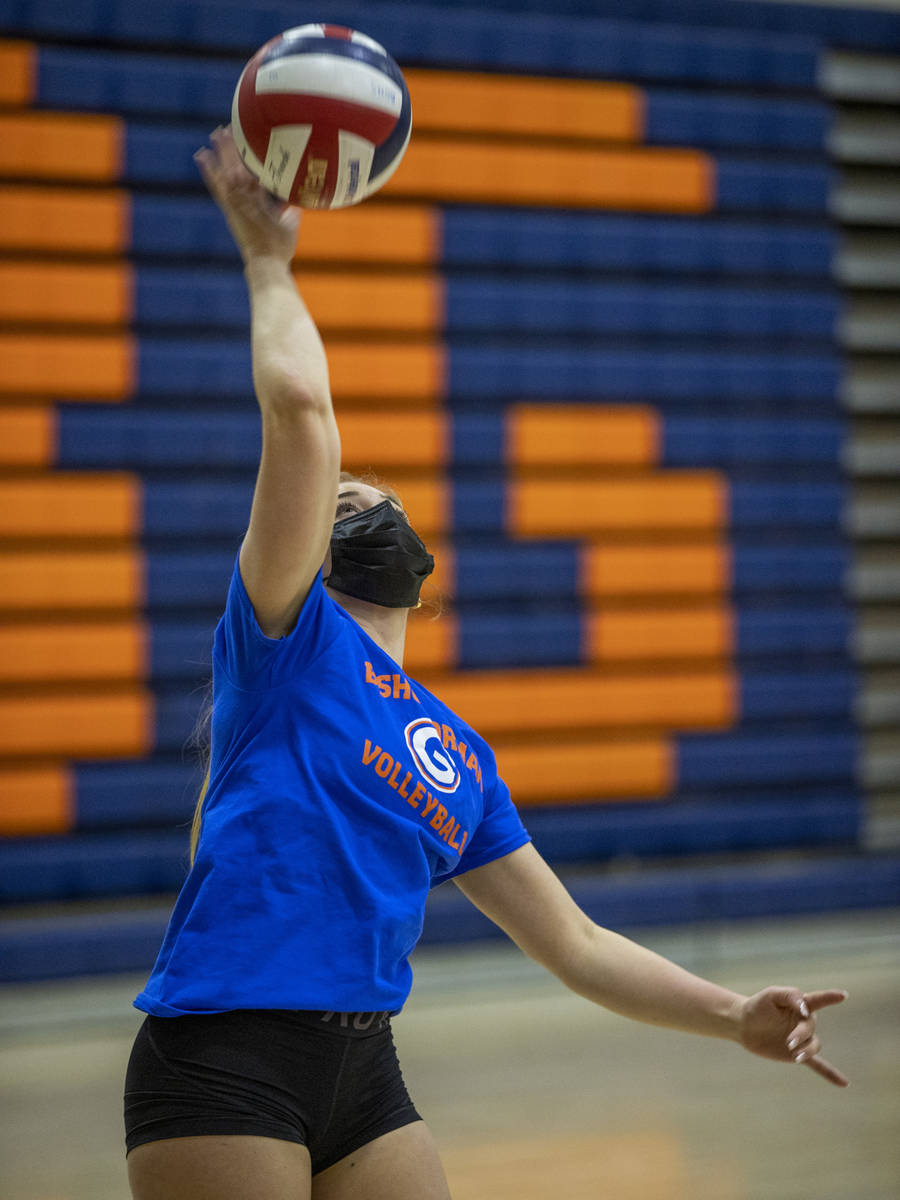 Morgan Mixer serves the ball during a varsity girls volleyball practice at Bishop Gorman High S ...