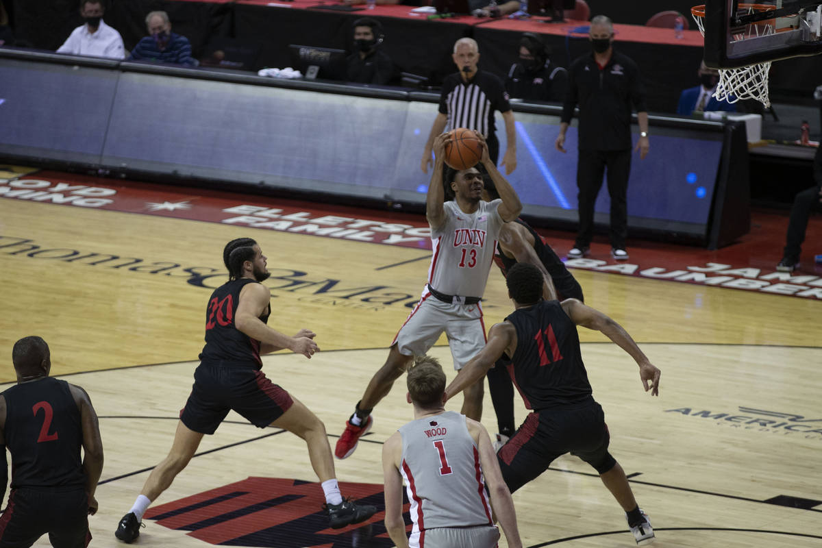 UNLV Rebels guard Bryce Hamilton (13) goes up for a shot against San Diego State Aztecs forward ...