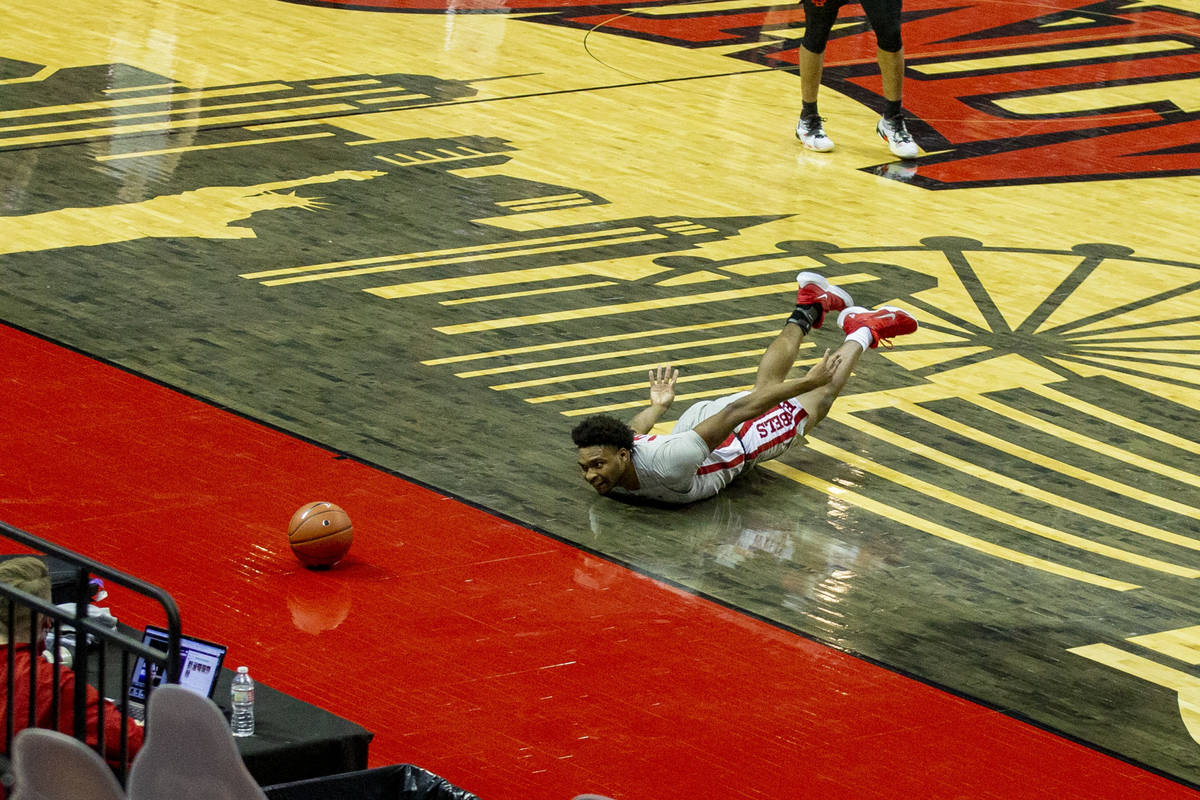 UNLV Rebels guard Bryce Hamilton (13) dives after a loose ball during the first half of an NCAA ...