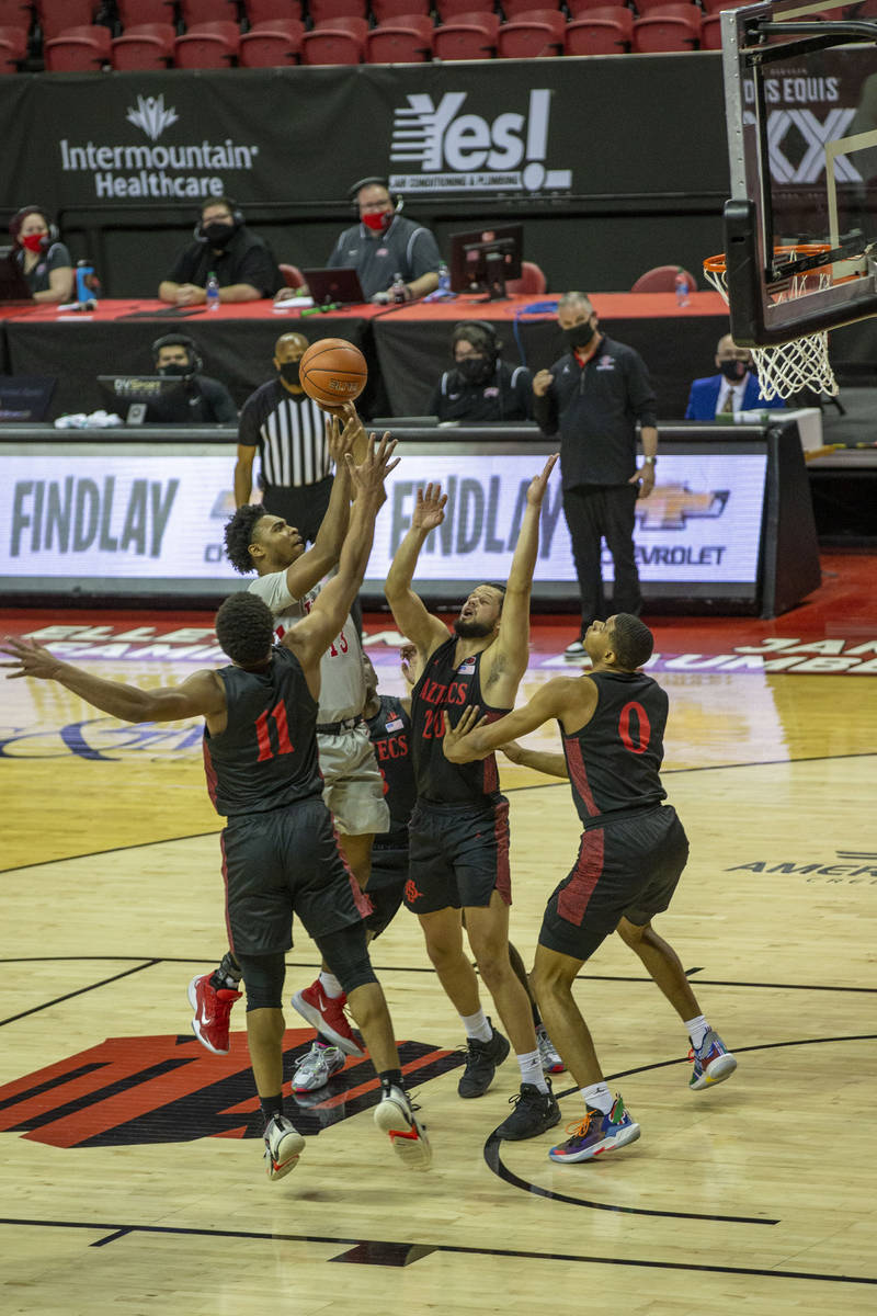 UNLV Rebels guard Bryce Hamilton (13) shoots the basketball surrounded by San Diego State Aztec ...