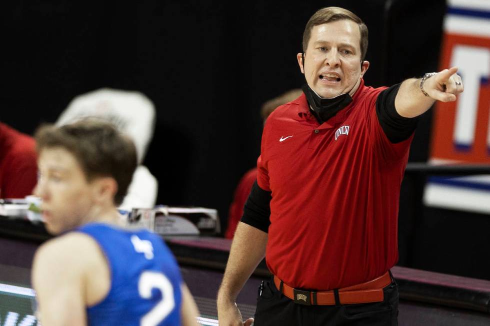 UNLV Rebels head coach T.J. Otzelberger calls a play during an game on Saturday, Feb. 6, 2021, ...