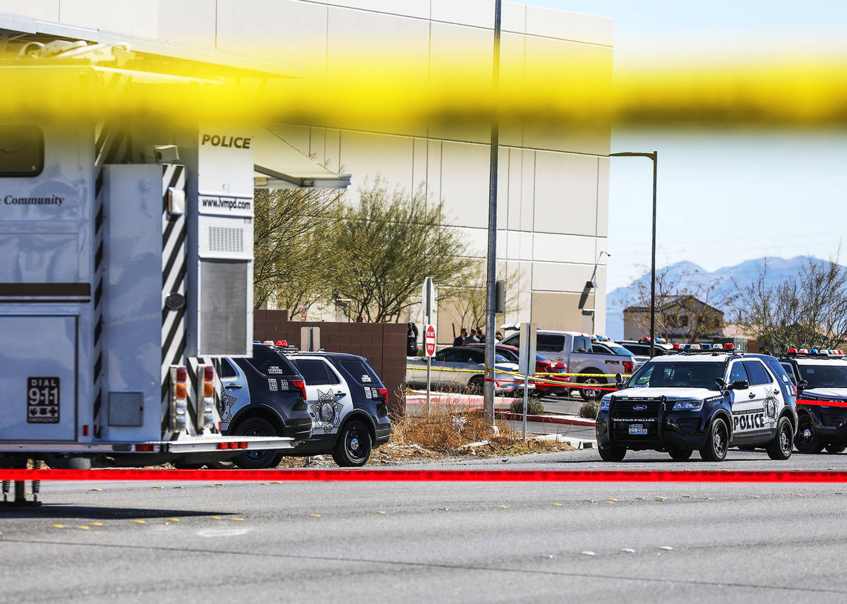 Police investigate the scene of an officer-involved shooting Monday, March 1, 2021 in northeast ...