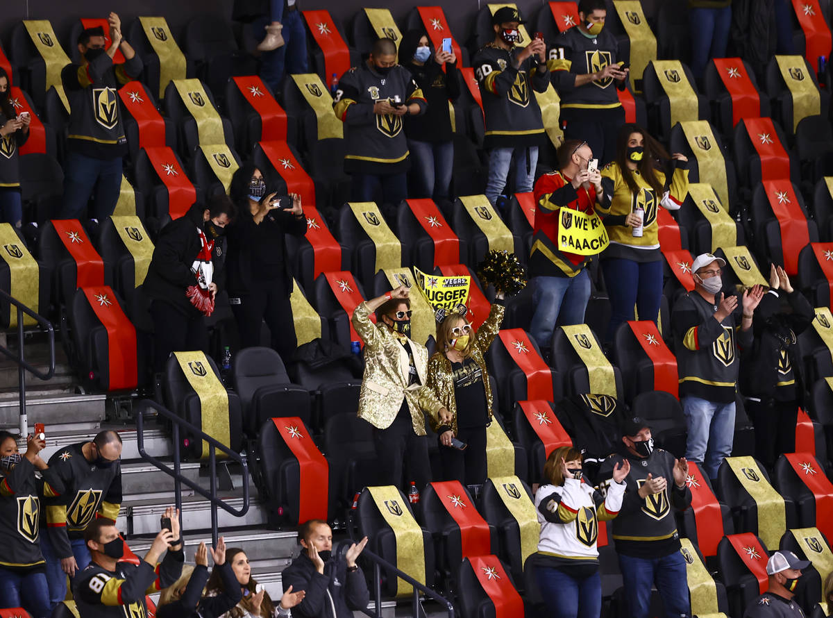 Golden Knights fans celebrate an overtime win against the Minnesota Wild in an NHL hockey game ...