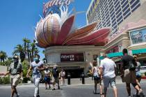 Tourists walk along Las Vegas Boulevard near the Flamingo on Friday, July 3, 2020, in Las Vegas ...