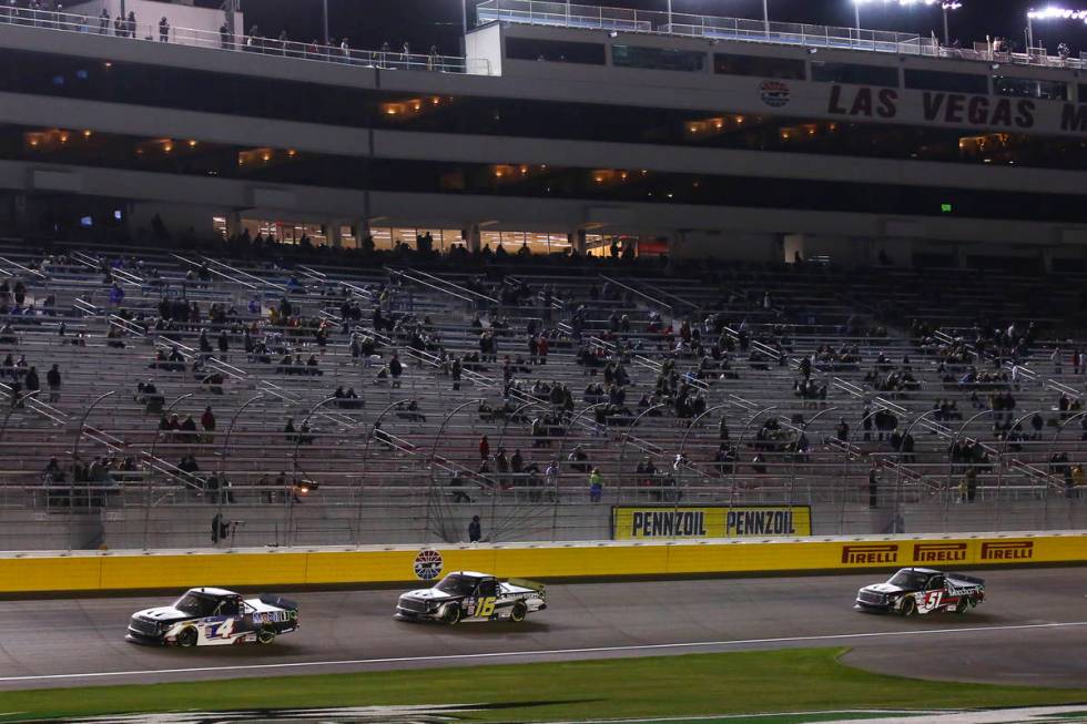 John Nemechek (4) leads ahead of Austin Hill (16) and Kyle Busch (51) during a restart in a NAS ...