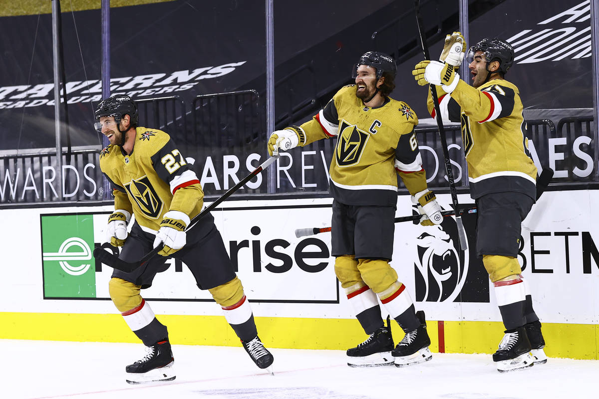 Golden Knights left wing Max Pacioretty, right, celebrates his overtime goal against the Anahei ...