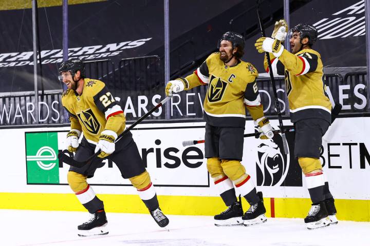 Golden Knights left wing Max Pacioretty, right, celebrates his overtime goal against the Anahei ...