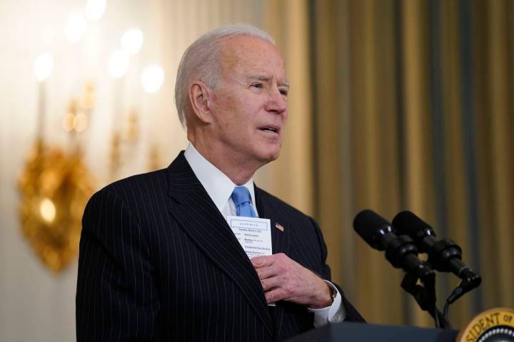 President Joe Biden speaks about efforts to combat COVID-19, in the State Dining Room of the Wh ...