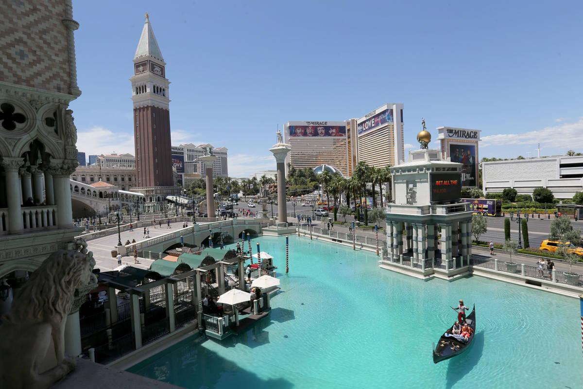 Guests take a gondola ride with a singing gondolier at The Venetian on the Strip in Las Vegas T ...